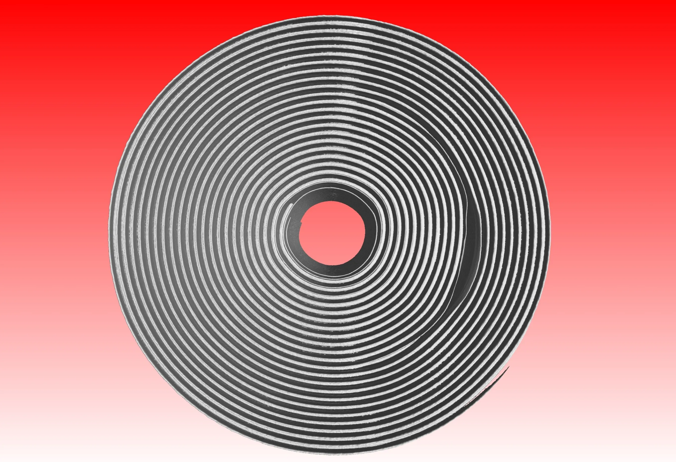 CT rendering of a cylindrical battery cell seen from the top, showing the wound electrode layers around the central mandrel hole